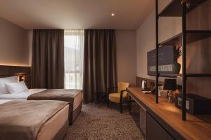 Postelja oz. postelje v sobi nastanitve Hotel Grof