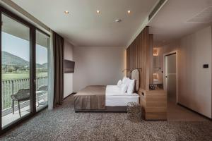 Postelja oz. postelje v sobi nastanitve Hotel Grof