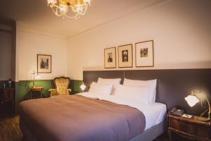 Posteľ alebo postele v izbe v ubytovaní HENRI Hotel Wien Siebterbezirk