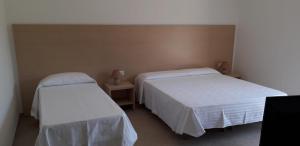 Postel nebo postele na pokoji v ubytování Albergo Athena Mare