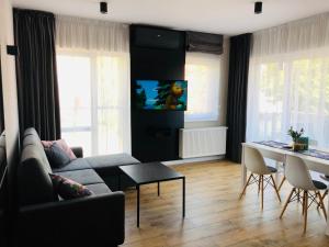 Posedenie v ubytovaní DOBRY MOMENT - apartament Giżycko