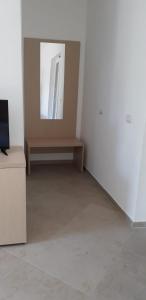 TV a/nebo společenská místnost v ubytování Albergo Athena Mare