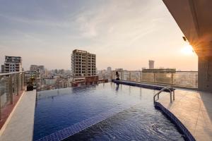 a swimming pool on the roof of a building at SOHO Residence in Phnom Penh