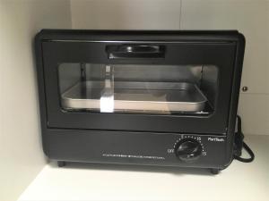 a black toaster oven sitting on a counter at 002.Standard Number in Kumamoto