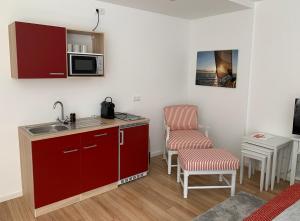 Kuchyň nebo kuchyňský kout v ubytování Luxx City Apartments