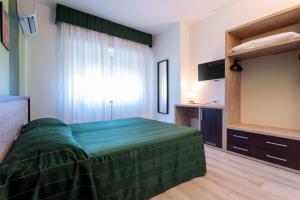 Letto o letti in una camera di Hotel Bellavista