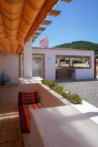 a view of a house with a couch on a patio at Casas de Santa Rita in Évora Monte