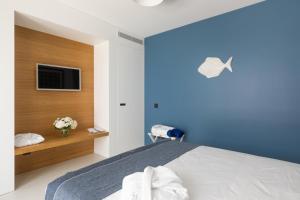 Een bed of bedden in een kamer bij Santa Caterina - Dimora sul mare