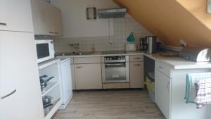 Kuchyň nebo kuchyňský kout v ubytování Kummerower See + 12 fotografií