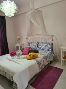 a bedroom with a bed with pillows on it at Algarve/Sra da Rocha in Porches +67 photos