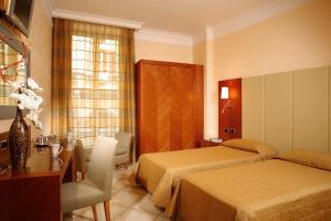 Posteľ alebo postele v izbe v ubytovaní Suite Opera Rooms
