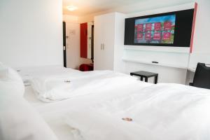 Ένα ή περισσότερα κρεβάτια σε δωμάτιο στο Hotel Andante Rust