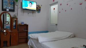 Postel nebo postele na pokoji v ubytování Homstay An Nhien