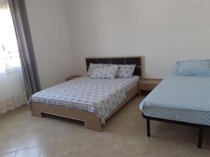 A bed or beds in a room at Sunset House Aurora&Ersi