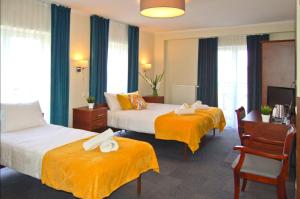 Posteľ alebo postele v izbe v ubytovaní Hotel Przy Solankach