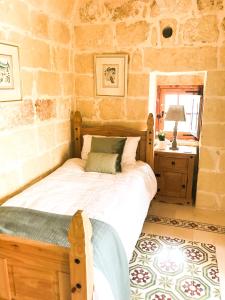 Letto o letti in una camera di L'Gharix Temple Retreat