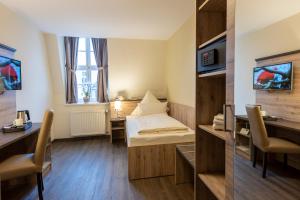 TV a/nebo společenská místnost v ubytování Hotel Ratskeller Schwarzenberg