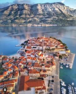 an island in the middle of a body of water at Guest House Dijana in Korčula