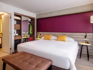 Postel nebo postele na pokoji v ubytování Mercure Ariosto Lima