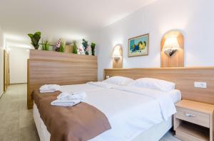 Postel nebo postele na pokoji v ubytování Villa Paradiso 2