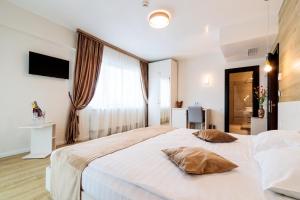Postel nebo postele na pokoji v ubytování Hotel Bulevard