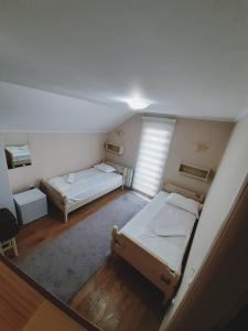 Ένα ή περισσότερα κρεβάτια σε δωμάτιο στο Guest House Colovic