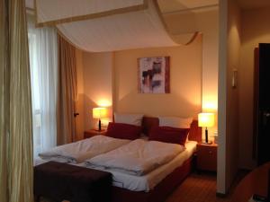 Postel nebo postele na pokoji v ubytování Ringhotel Bundschu