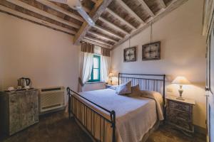 Кровать или кровати в номере Country Relais La Mortella