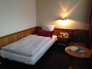 Postel nebo postele na pokoji v ubytování Ringhotel Bundschu + 37 fotografií