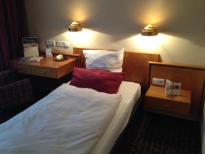 Postel nebo postele na pokoji v ubytování Ringhotel Bundschu