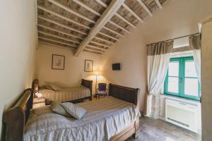 Кровать или кровати в номере Country Relais La Mortella