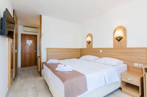 Postel nebo postele na pokoji v ubytování Villa Paradiso 2