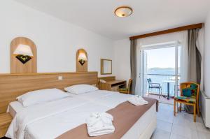 Postel nebo postele na pokoji v ubytování Villa Paradiso 2