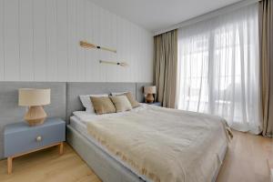 Postel nebo postele na pokoji v ubytování Comfort Apartments Granaria
