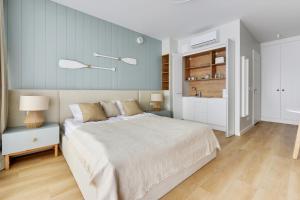 Postel nebo postele na pokoji v ubytování Comfort Apartments Granaria