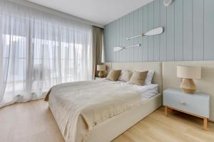 Postel nebo postele na pokoji v ubytování Comfort Apartments Granaria