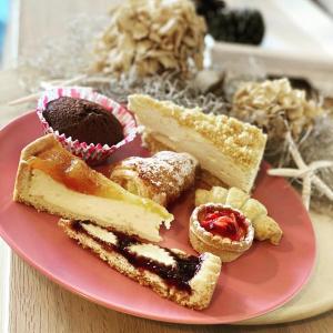 a pink plate with different types of desserts on it at B&B Antico Telaio in Santa Maria Navarrese