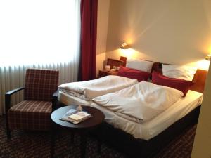 Postel nebo postele na pokoji v ubytování Ringhotel Bundschu