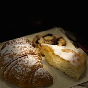 two pastries are sitting on a plate at B&B Antico Telaio in Santa Maria Navarrese