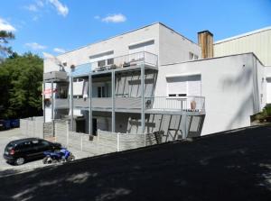 a motorcycle parked in front of a white building at KS GbR Wohnungen in Mechernich