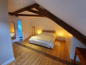 Un pat sau paturi într-o cameră la Duplex des montains