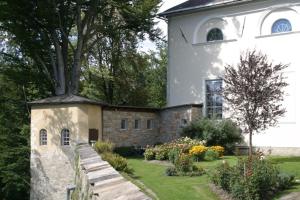 a large white building with a fence in front of it at Kloster Wernberg in Wernberg