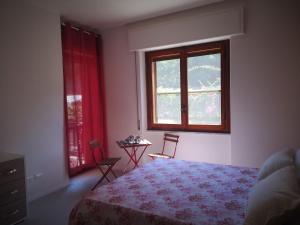 A bed or beds in a room at Il Giardino di Anna - Charming rooms in Cagliari
