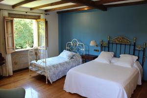 Giường trong phòng chung tại Casa Grande de Soutullo
