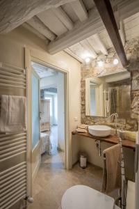 a bathroom with a sink and a mirror at Casa Collodi Castello in Collodi +44 photos