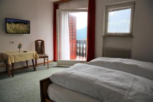 Postel nebo postele na pokoji v ubytování Garni Marianne