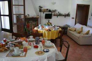 a living room with a table with food on it at Villa Franca in Pula