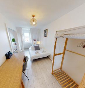 a bedroom with a bunk bed and a living room at Le Quai KOCH in Strasbourg