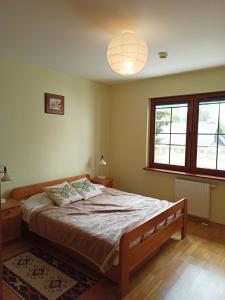 Ένα ή περισσότερα κρεβάτια σε δωμάτιο στο Apartament 26 Widok - Pod Aniołem
