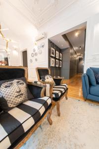 a living room with two chairs and a couch at Bliss Lisbon Apartments - Avenidas in Lisbon